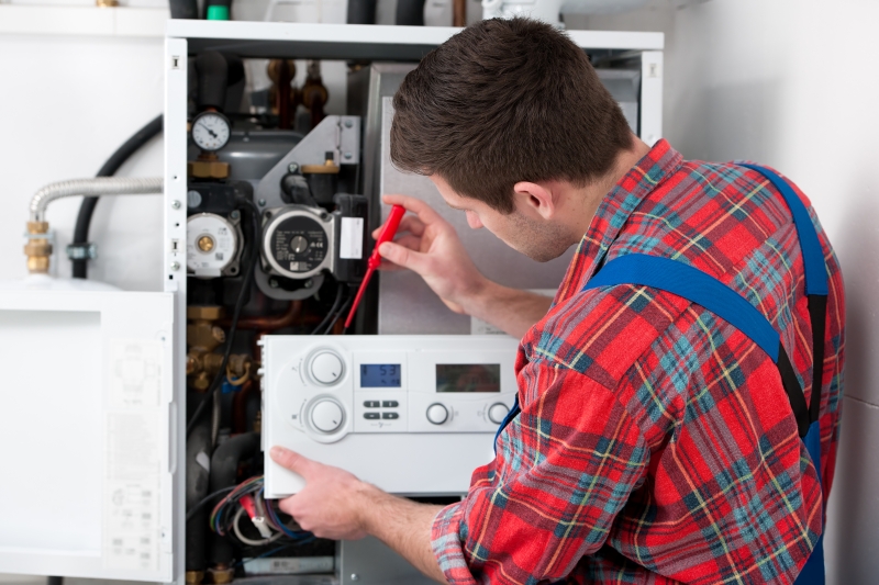 Gas Safe engineer working on a boiler in Camberwell